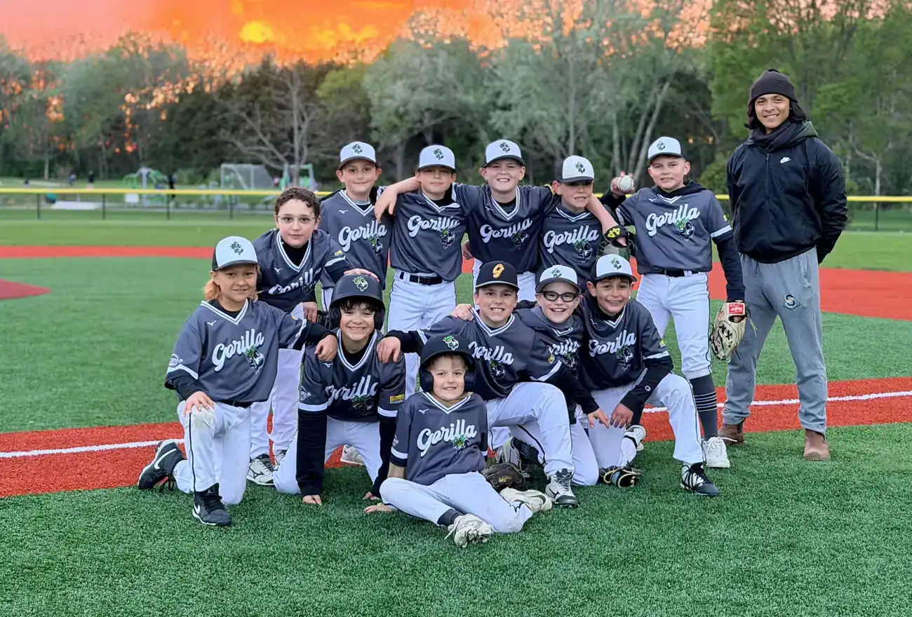A Gorilla Baseball Club team on the turf at sunset