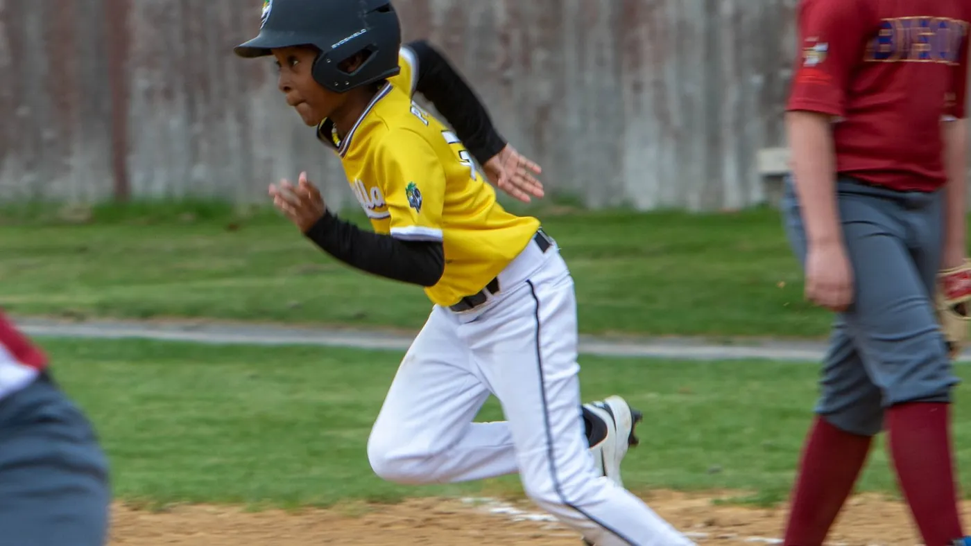 A Gorilla Baseball Club baserunner sprinting toward the next base