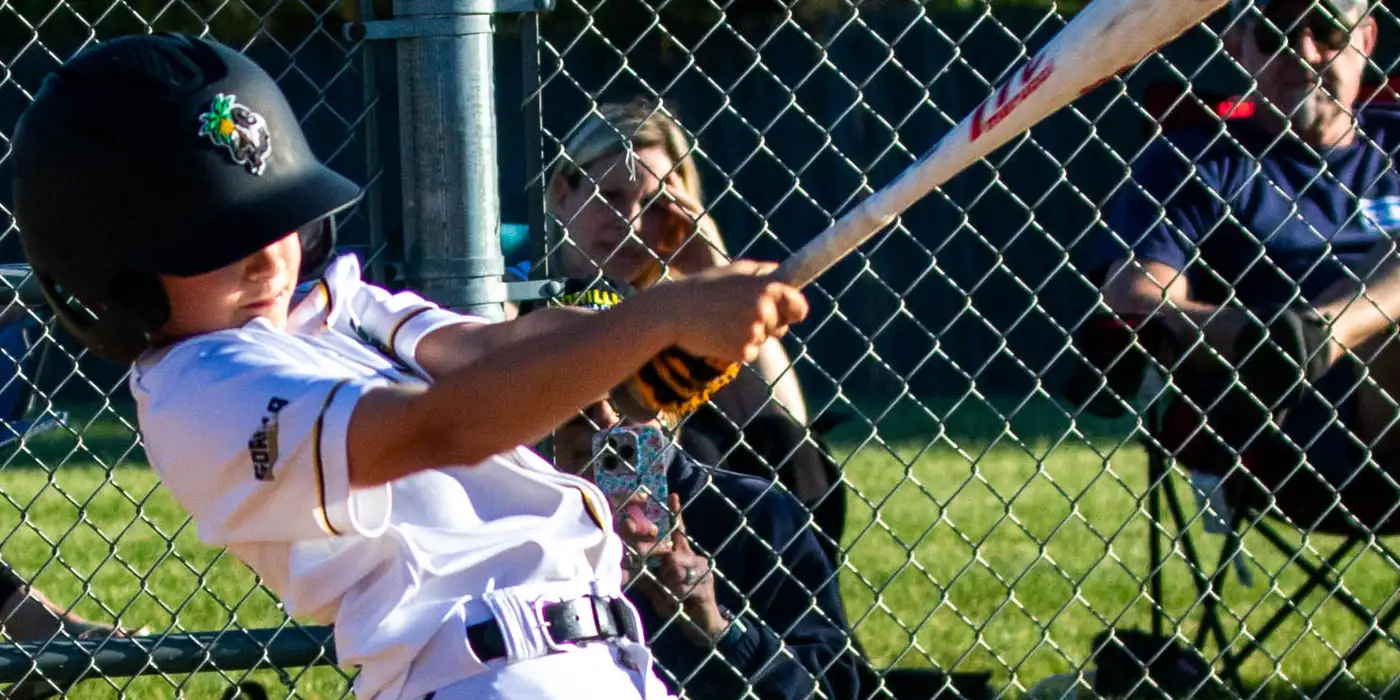 A Gorilla Baseball Club hitter finishing his swing during a game