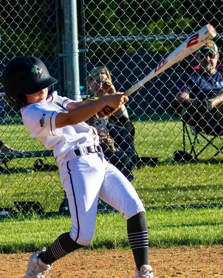 A Gorilla Baseball Club hitter finishing his swing during a game
